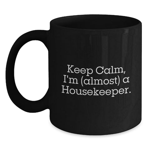 Image of Funny Housekeeper Gifts for Men, Women - Black Coffee Mug with 'Keep Calm, I'm (almost) A Housekeeper.' Quote - Gifts from Family and Friends to Housekeeper on Graduation - Main