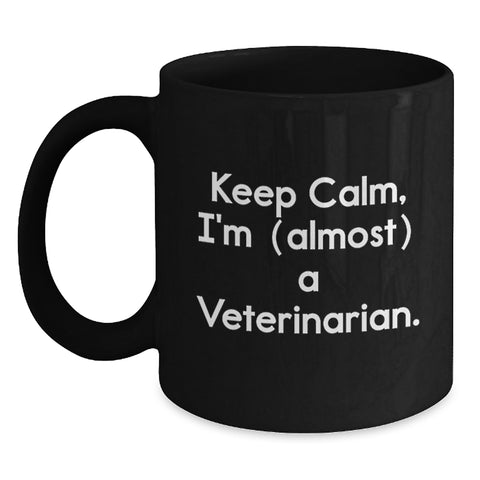 Image of Funny Veterinarian Gifts for Graduation, Black Coffee Mug, 'Keep Calm, I'm (almost) A Veterinarian.', Gifts from Family to Veterinarian Men - Main