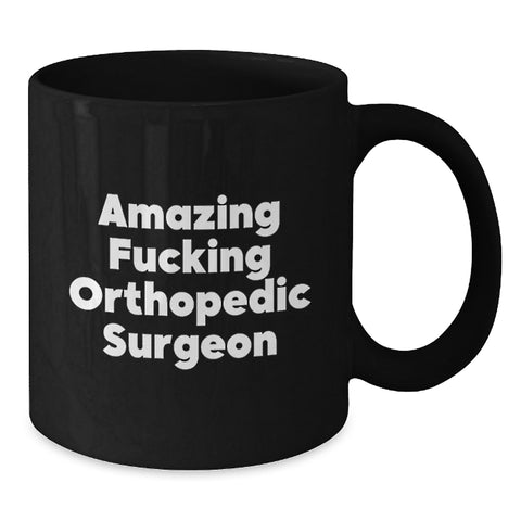 Image of Funny Orthopedic Surgeon Gifts for Men, Black Coffee Mug for Orthopedic Surgeon, 'Amazing F--king Orthopedic Surgeon' Quote - Additional