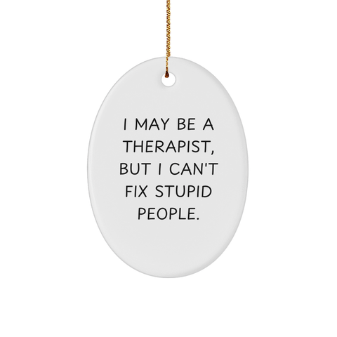 Image of Therapist Gifts from Friends - Funny Oval Ornament for Christmas 'I May Be A Therapist, But I Can't Fix Stupid People.' - Image 1