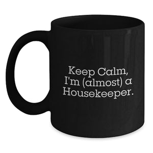 Funny Housekeeper Gifts for Men, Women - Black Coffee Mug with 'Keep Calm, I'm (almost) A Housekeeper.' Quote - Gifts from Family and Friends to Housekeeper on Graduation - Main