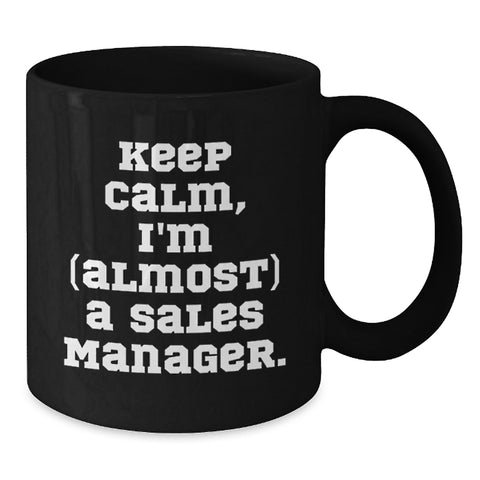 Image of Funny Sales Manager Gifts: Black Coffee Mug, 'Keep Calm, I'm (almost) A Sales Manager.' for Birthday, Gifts from Friends or Coworkers - Additional