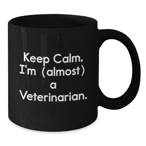 Image of Funny Veterinarian Gifts for Graduation, Black Coffee Mug, 'Keep Calm, I'm (almost) A Veterinarian.', Gifts from Family to Veterinarian Men - Additional
