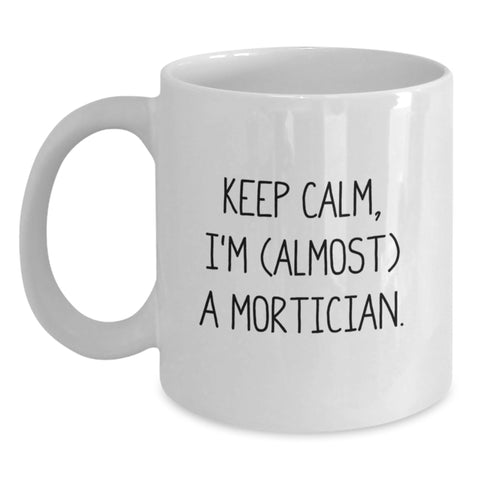 Image of Funny Mortician Gifts, Graduation Unique Gifts, White Coffee Mug - 'Keep Calm, I'm (almost) A Mortician.' - Main