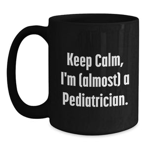 Funny Pediatrician Gifts for Men, Women, and Friends - Keep Calm, I'm (almost) A Pediatrician Black Coffee Mug, Graduation Unique Gifts from Family
