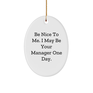 Inspirational Manager Gift Idea, Be Nice To Me. I May Be Your Manager One Day., Oval Ornament for Christmas, White Sturdy MDF, 3in, Gold Tone String - Image 1