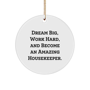 Funny Housekeeper Gifts for Christmas, 'Dream Big, Work Hard, And Become An Amazing Housekeeper', Circle Ornament Gifts from Friends, Family, or Coworkers - Image 1