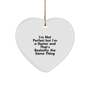 Funny Doctor Gifts for Christmas, 'I'm Not Perfect But I'm A Doctor And That's Basically The Same Thing' Heart Ornament Gifts from Friends to Family - Image 1
