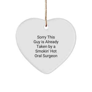 Funny Oral Surgeon Gifts from Friends for Christmas - Heart Ornament with 'Sorry This Guy Is Already Taken By A Smokin' Hot Oral Surgeon' Quote, Gifts for Men, Women, Family - Image 1