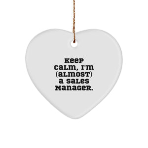 Sales Manager Gifts, Funny Heart Ornament, 'Keep Calm, I'm (almost) A Sales Manager.' for Christmas - Image 1