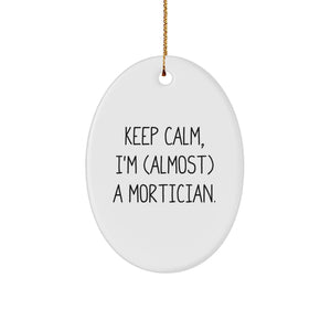 Funny Mortician Gifts, Oval Ornament, 'Keep Calm, I'm almost a Mortician', Gifts from Friends, Family, or Coworkers, for Mortician, Men, or Women, Christmas Unique Gifts - Image 1